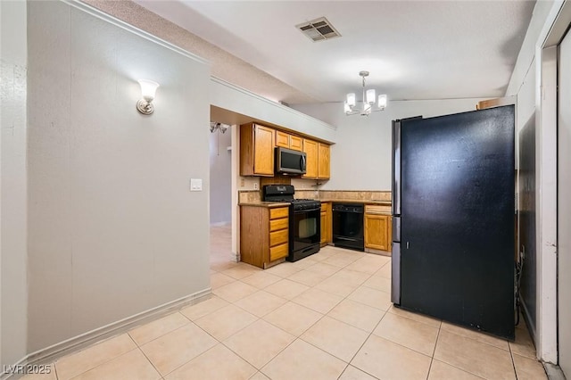 kitchen with light tile patterned floors, visible vents, black appliances, and a notable chandelier
