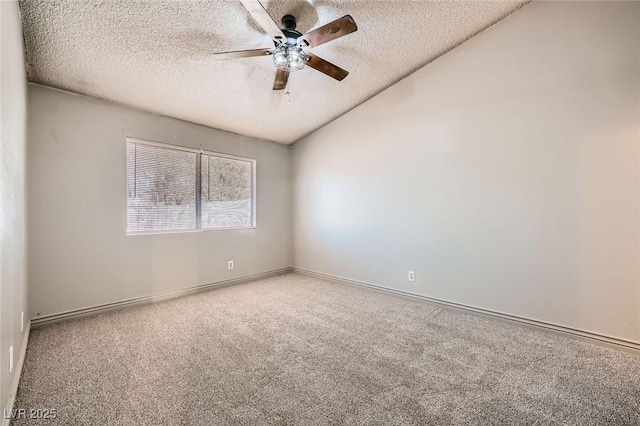 carpeted empty room featuring baseboards, a textured ceiling, ceiling fan, and vaulted ceiling