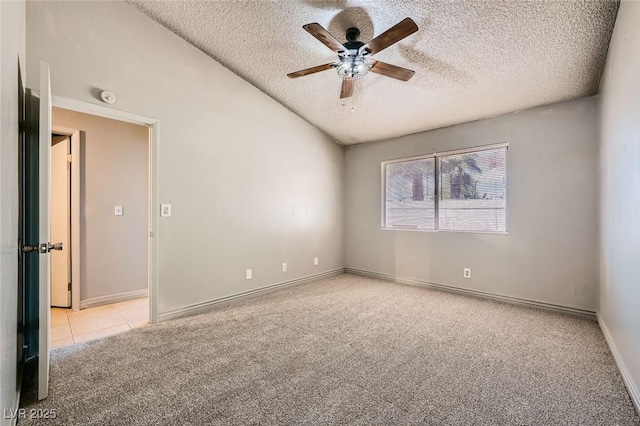 unfurnished room with carpet flooring, a ceiling fan, a textured ceiling, and baseboards