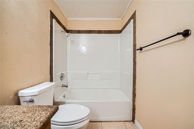 bathroom with crown molding, toilet, tile patterned floors, baseboards, and bathing tub / shower combination