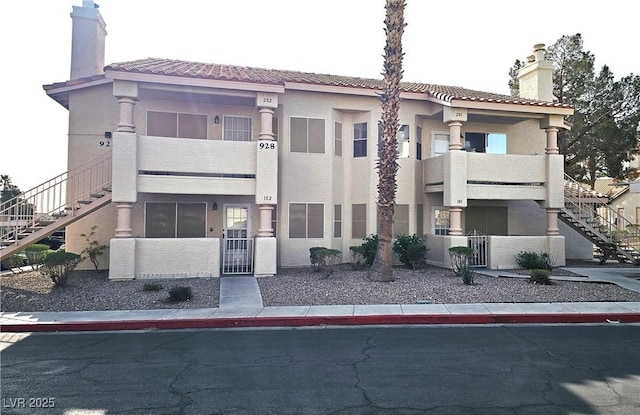 view of property featuring stairway