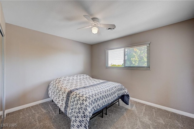 bedroom featuring carpet floors, a ceiling fan, and baseboards