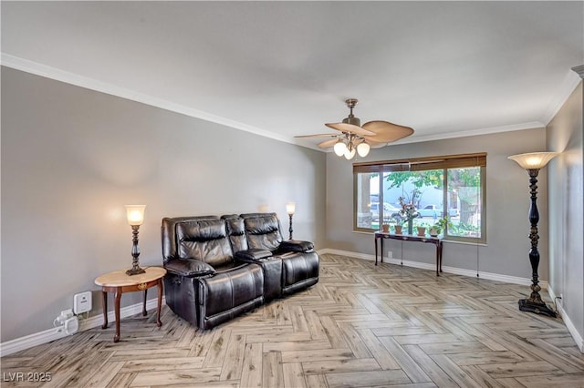 living room with crown molding, ceiling fan, and baseboards