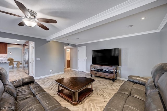 living room with visible vents, ornamental molding, baseboards, ceiling fan, and a barn door