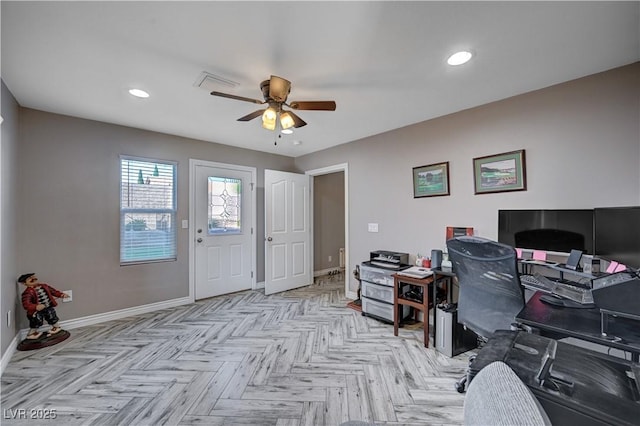 office space featuring recessed lighting, ceiling fan, visible vents, and baseboards