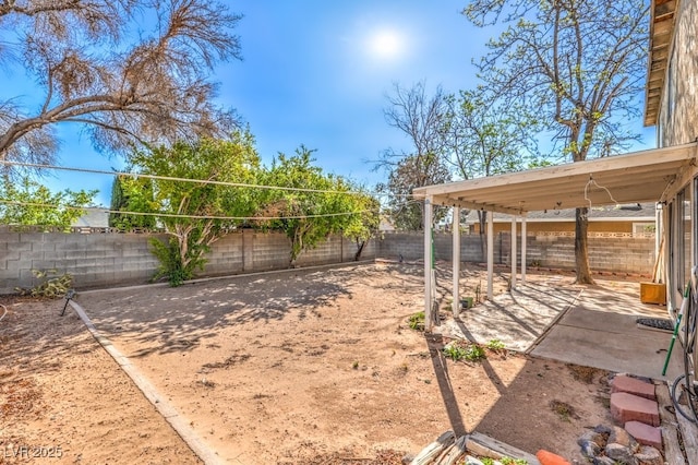 view of yard with a fenced backyard and a patio