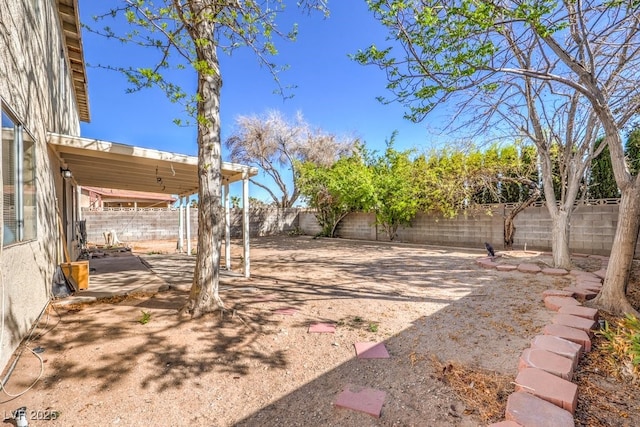 view of yard with a patio area and a fenced backyard