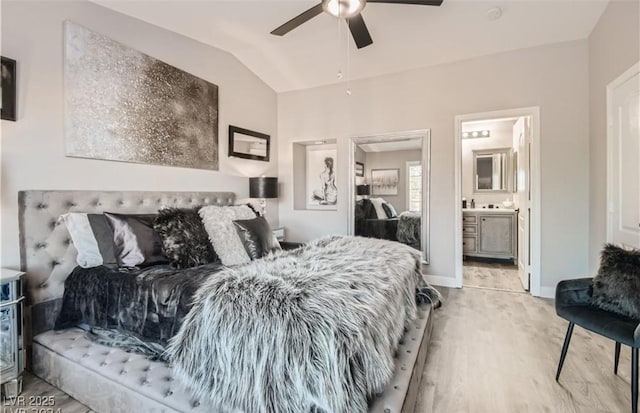 bedroom featuring light wood-style flooring, ceiling fan, vaulted ceiling, and baseboards