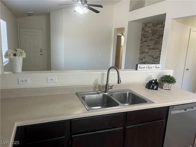 kitchen featuring stainless steel dishwasher, a sink, dark brown cabinets, ceiling fan, and light countertops