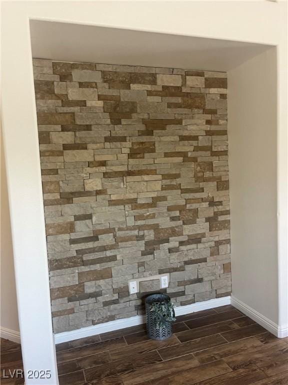 interior details with wood finish floors and baseboards