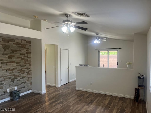 unfurnished room with lofted ceiling, visible vents, dark wood-style flooring, and ceiling fan