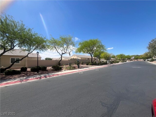 view of road with curbs and sidewalks
