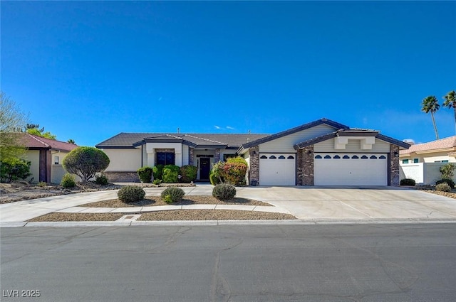 view of front of home with driveway and an attached garage