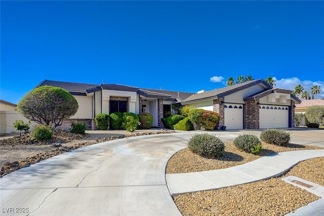 ranch-style house with concrete driveway and an attached garage