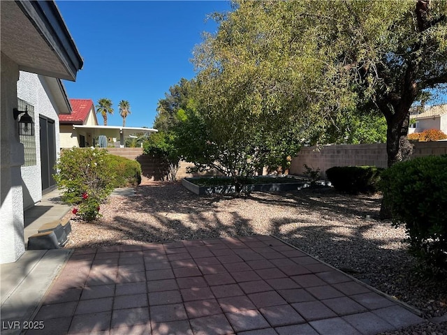 view of patio featuring fence