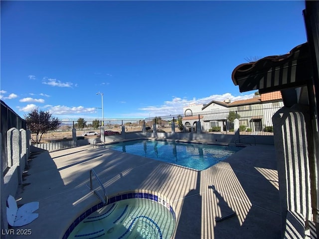 pool featuring a patio area, a hot tub, and fence
