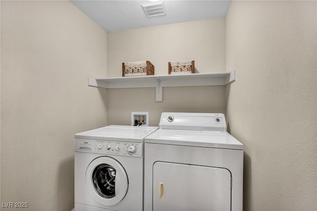 10550 W Alexander Rd Unit 2103, Las Vegas, NV 89129 - laundry room with washing machine and dryer