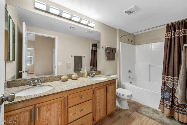 10550 W Alexander Rd Unit 2103, Las Vegas, NV 89129 - bathroom featuring wood finished floors, double vanity, and shower / tub combo