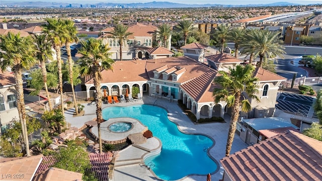10550 W Alexander Rd Unit 2103, Las Vegas, NV 89129 - view of pool featuring a mountain view, a patio, a pool with connected hot tub, and a residential view