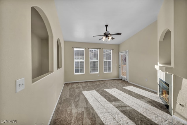 10550 W Alexander Rd Unit 2103, Las Vegas, NV 89129 - unfurnished living room featuring a ceiling fan, carpet flooring, and a fireplace with flush hearth
