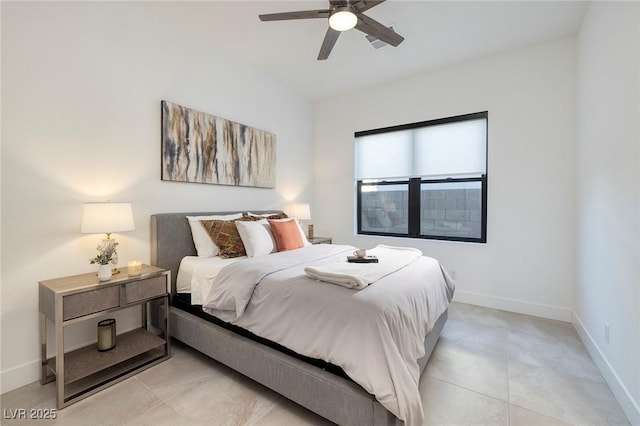 bedroom with baseboards and a ceiling fan
