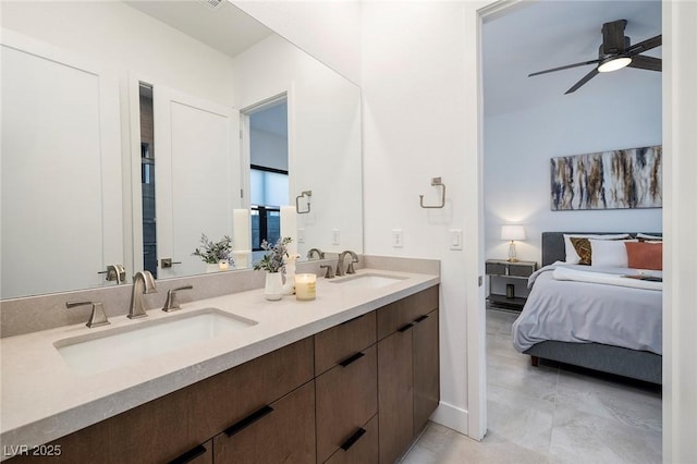 bathroom with a sink, double vanity, ensuite bath, and a ceiling fan