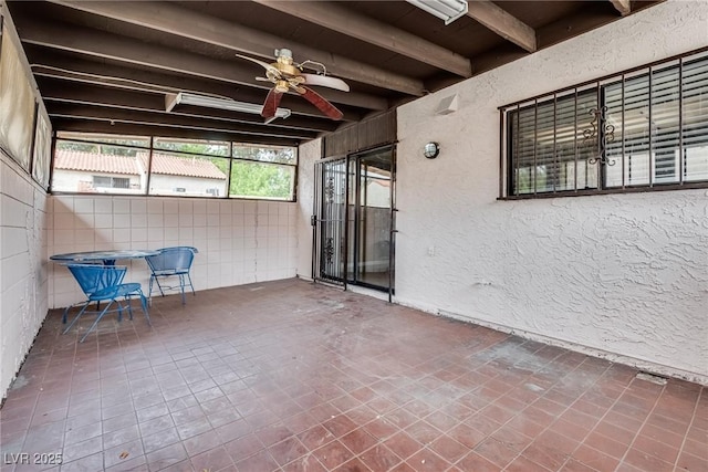 3350 Duece St, Las Vegas, NV 89121 - unfurnished sunroom featuring beam ceiling