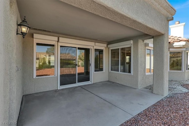 view of patio with visible vents