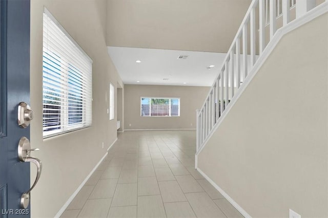 tiled foyer with baseboards, visible vents, recessed lighting, and stairway