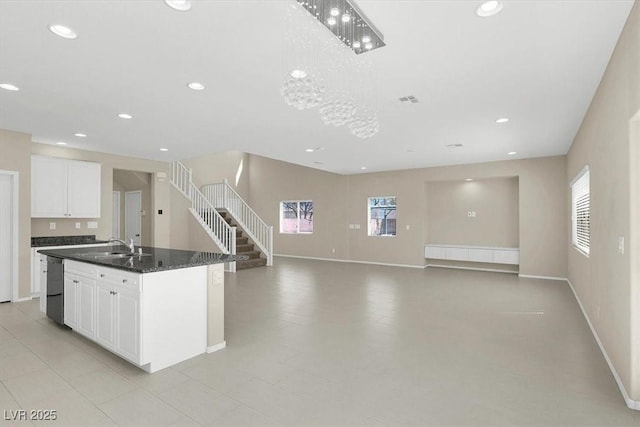 kitchen with dishwashing machine, a healthy amount of sunlight, and recessed lighting