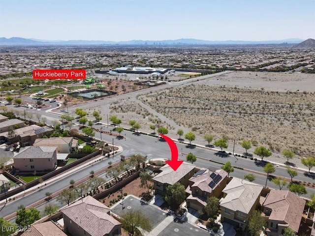 aerial view featuring a mountain view and a residential view