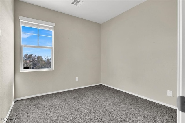 spare room featuring baseboards, carpet flooring, and visible vents