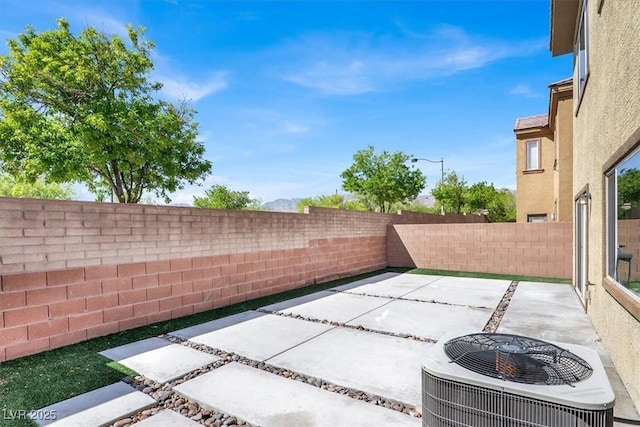 view of patio / terrace with a fenced backyard and cooling unit