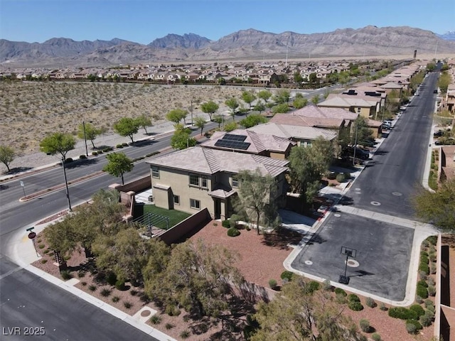 birds eye view of property with a residential view and a mountain view