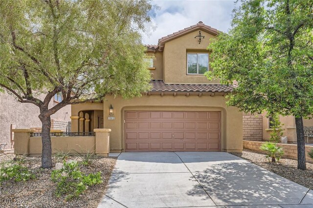 11913 Alava Ave, Las Vegas, NV 89138 - mediterranean / spanish house featuring a tiled roof, stucco siding, a garage, and driveway