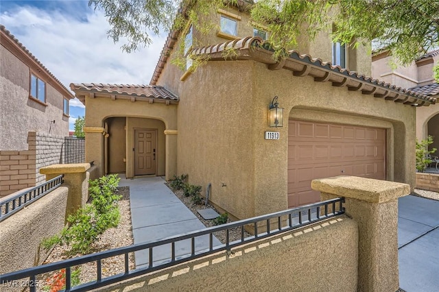 11913 Alava Ave, Las Vegas, NV 89138 - doorway to property featuring stucco siding, a tile roof, and an attached garage