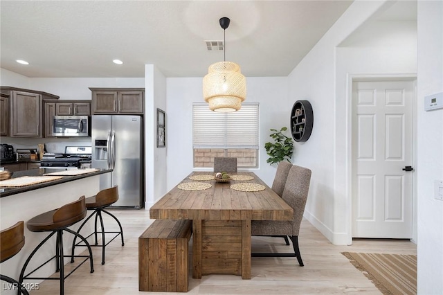 11913 Alava Ave, Las Vegas, NV 89138 - dining room with light wood finished floors and recessed lighting