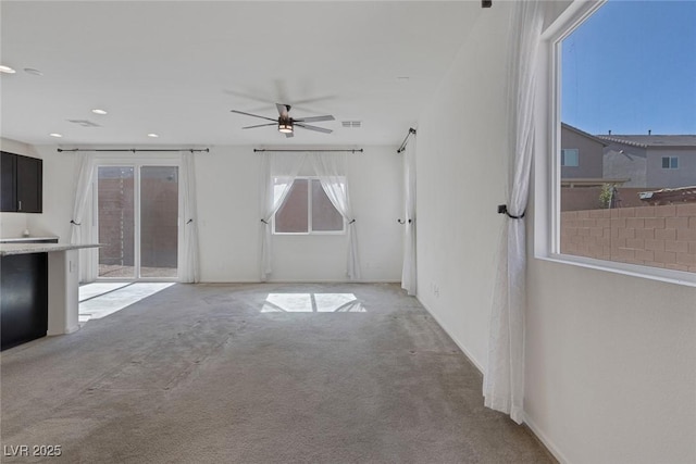 5589 Pico Ferrera Ct, Las Vegas, NV 89113 - unfurnished living room with ceiling fan, light colored carpet, visible vents, and recessed lighting