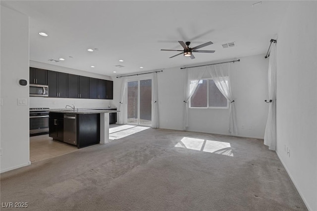 5589 Pico Ferrera Ct, Las Vegas, NV 89113 - unfurnished living room with a sink, visible vents, ceiling fan, light carpet, and recessed lighting