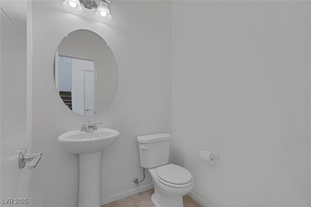 5589 Pico Ferrera Ct, Las Vegas, NV 89113 - half bath with toilet, tile patterned flooring, and baseboards
