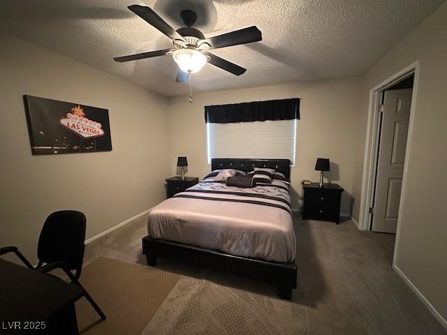 7900 Fossil Creek Ln Unit 103, Las Vegas, NV 89145 - carpeted bedroom featuring baseboards, ceiling fan, and a textured ceiling
