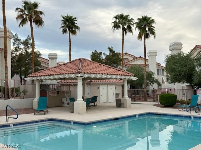 7900 Fossil Creek Ln Unit 103, Las Vegas, NV 89145 - community pool with a gazebo, a patio area, and fence