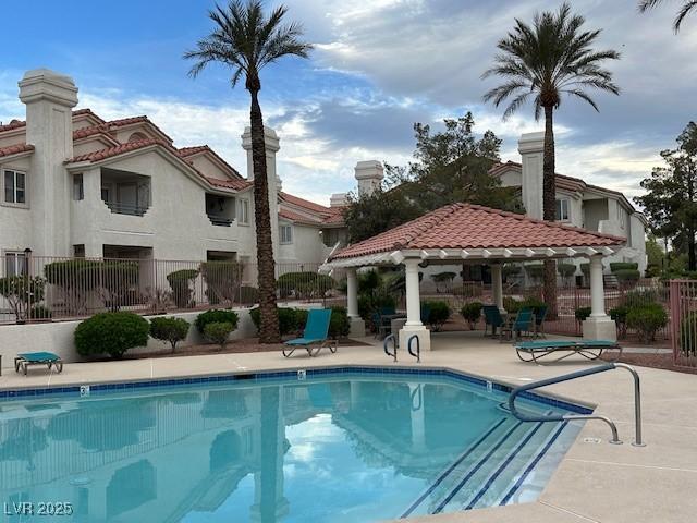 7900 Fossil Creek Ln Unit 103, Las Vegas, NV 89145 - community pool featuring a patio, a gazebo, and fence