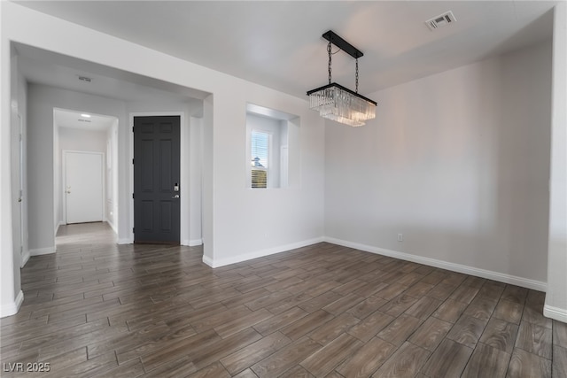 5940 Tamarack Lodge Ln, North Las Vegas, NV 89081 - unfurnished room featuring baseboards, visible vents, and dark wood-style flooring