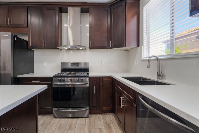 5940 Tamarack Lodge Ln, North Las Vegas, NV 89081 - kitchen with wall chimney range hood, appliances with stainless steel finishes, a sink, and light countertops