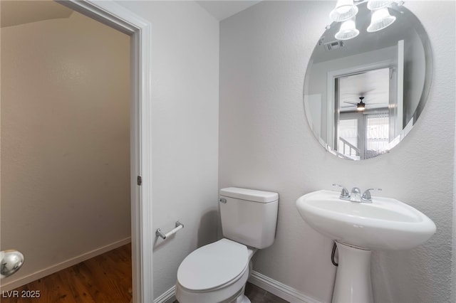 5940 Tamarack Lodge Ln, North Las Vegas, NV 89081 - bathroom with wood finished floors, visible vents, toilet, and baseboards