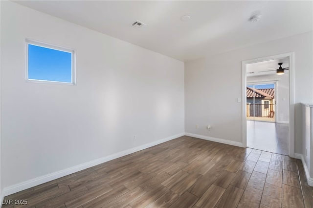 5940 Tamarack Lodge Ln, North Las Vegas, NV 89081 - spare room with baseboards, wood finished floors, visible vents, and ceiling fan