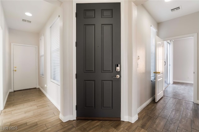 5940 Tamarack Lodge Ln, North Las Vegas, NV 89081 - entrance foyer featuring baseboards, wood finished floors, and visible vents