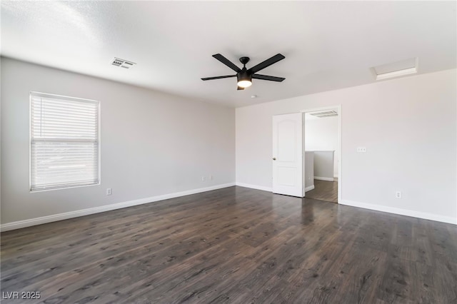 5940 Tamarack Lodge Ln, North Las Vegas, NV 89081 - unfurnished room featuring attic access, visible vents, baseboards, and dark wood-style flooring