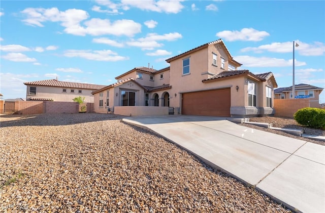 5940 Tamarack Lodge Ln, North Las Vegas, NV 89081 - mediterranean / spanish-style house with stucco siding, a tile roof, fence, and a garage